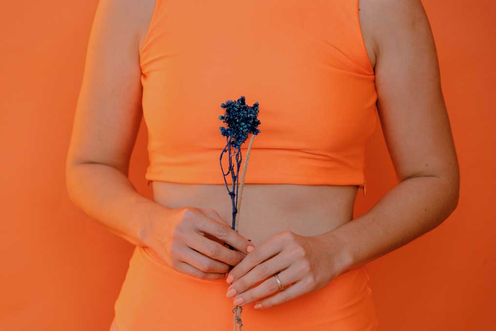 Photo of a woman holding a flower